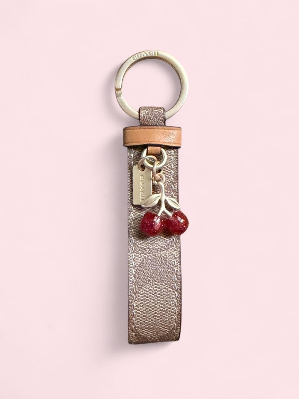 Brand new Coach keychain with red cherry charms